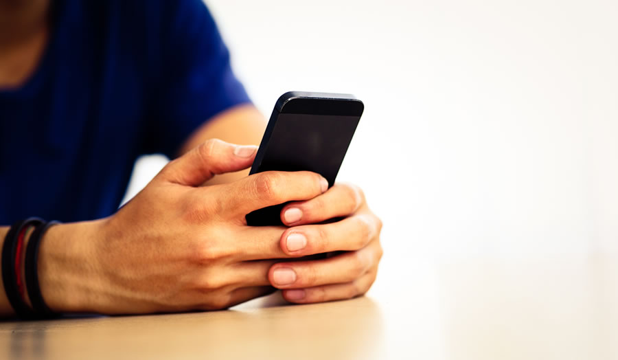 Hands and mobile phone