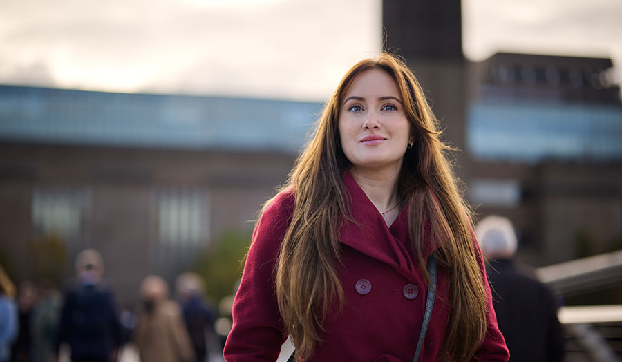 Ena smiling outside Tate Modern in London