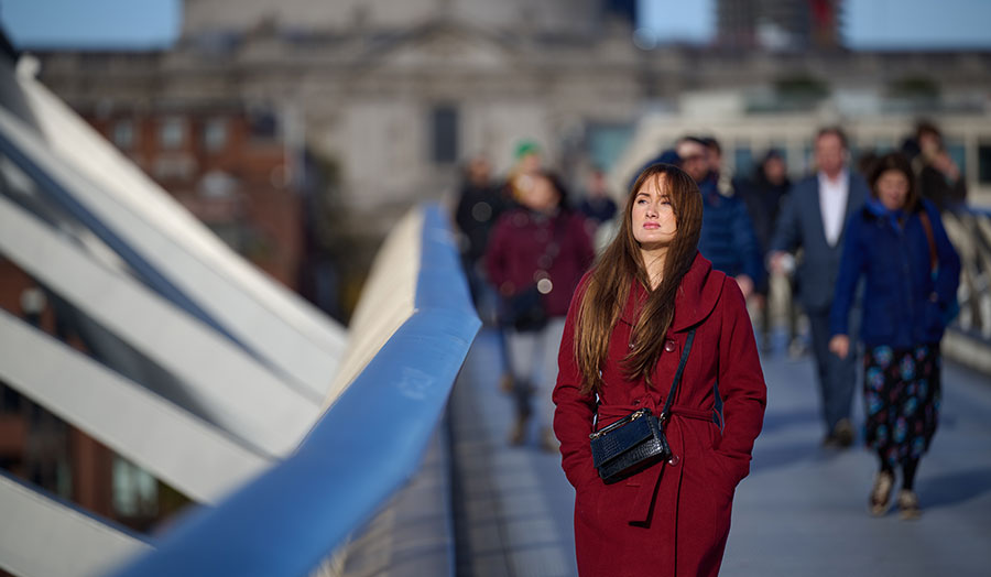 Ena on one of the London bridges with people behind her
