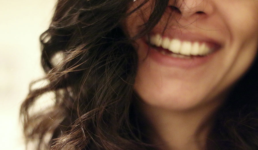 A woman smiling